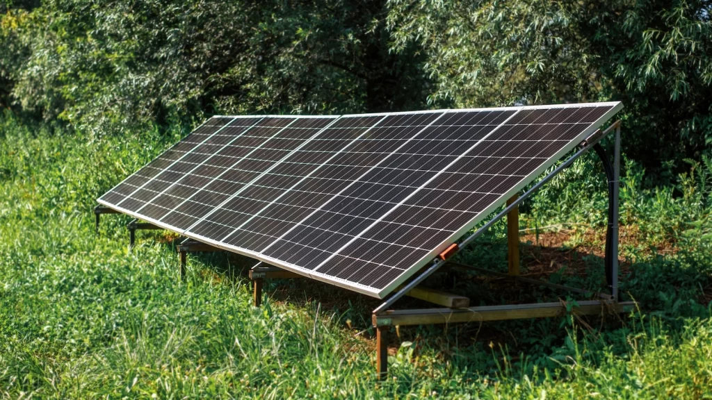 Solar panel ground nature greenery around with sun power.
